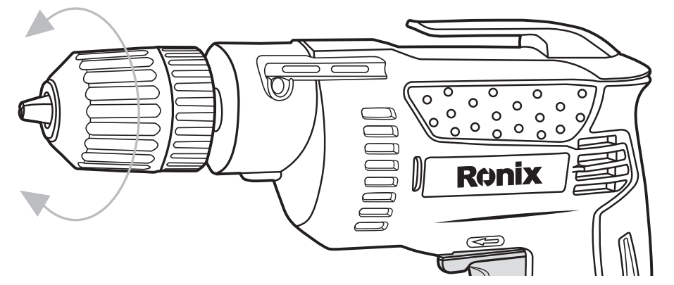 User wearing safety goggles and gloves while operating a power drill